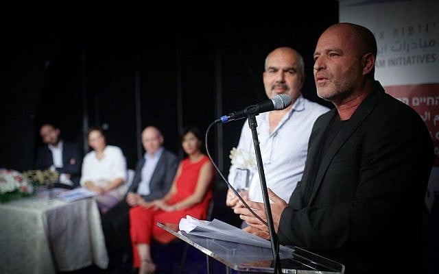 Co-CEO's of Tsofen, Sami Sadi and Paz Hirschmann, give their acceptance speech for the Champions of Shared Society Award, November 13, at the Arab Hebrew Theatre in Jaffa.