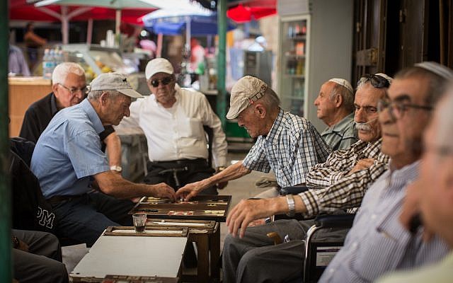 Elderly Israeli men play Backgammon at a coffee shop in the Mahane Yehuda Market in Jerusalem, on May 14, 2017. (Flash90/Hadas Parush) Elderly Israeli men play Backgammon at a coffee shop in the Mahane Yehuda Market in Jerusalem, on May 14, 2017. (Flash90/Hadas Parush)