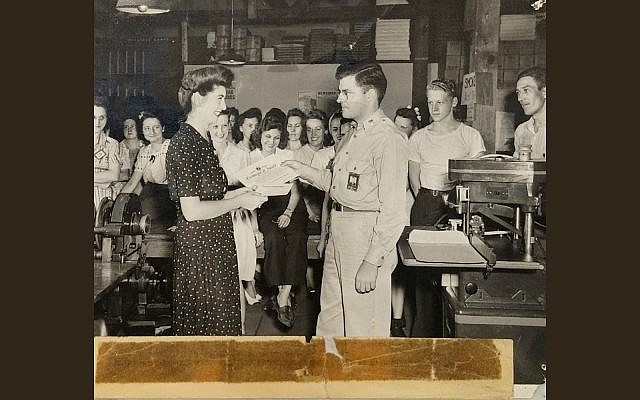 Jeanette Kern, left, receiving one of the two commendations she received for her work during World War II as a clerk in the Army Signal Corps, July 27, 1944. (Courtesy of Oren Hayon)