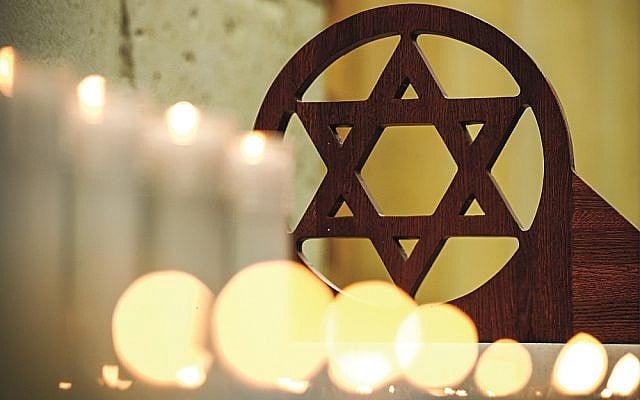 MOSCOW, RUSSIA - OCTOBER 28, 2018: Lit candles at a prayer service at the Moscow Jewish Community Centre for the victims of the 27 October 2018 shooting attack on a synagogue in Pittsburgh, United States. Mikhail Tereshchenko/TASS via Jewish News