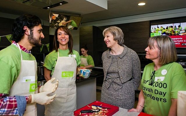 Theresa May Cooking with Mitzvah Day founder Laura Marks (right) and Daniela Pears (left) (Yakir Zur) Theresa May Cooking with Mitzvah Day founder Laura Marks (right) and Daniela Pears (left) (Yakir Zur)