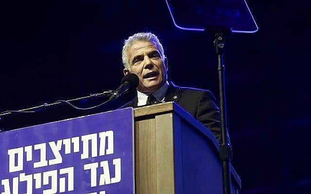 Yesh Atid head Yair Lapid speaks at a rally marking 23 years since the assassination of prime minister Yitzhak Rabin, at Tel Aviv's Rabin Square on November 3, 2018. (Miriam Alster/Flash90) Yesh Atid head Yair Lapid speaks at a rally marking 23 years since the assassination of prime minister Yitzhak Rabin, at Tel Aviv's Rabin Square on November 3, 2018. (Miriam Alster/Flash90)