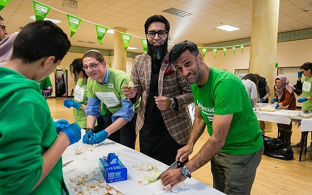 Jehangir Malik (right) getting stuck in to making some chicken soup for Mitzvah Day! Credit: Yakir Zur Jehangir Malik (right) getting stuck in to making some chicken soup for Mitzvah Day! Credit: Yakir Zur