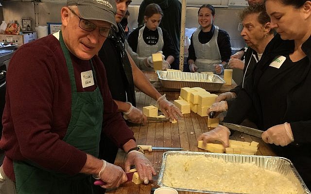 Volunteers preparing Christmas Dinner for 1070 people. (courtesy) Volunteers preparing Christmas Dinner for 1070 people. (courtesy)
