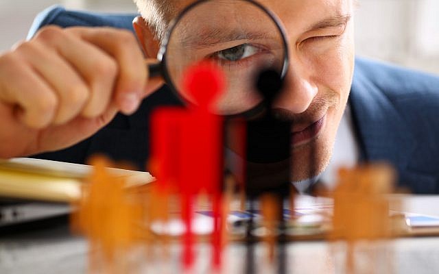 Illustrative. Investigating, under a magnifying glass. (iStock)