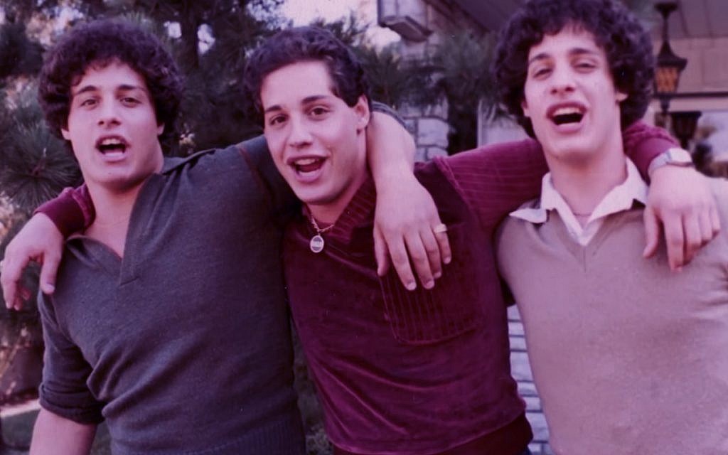 'Three Identical Strangers' is a documentary about triplets separated at birth by a Jewish-affiliated adoption agency in 1961. (Courtesy of NEON)