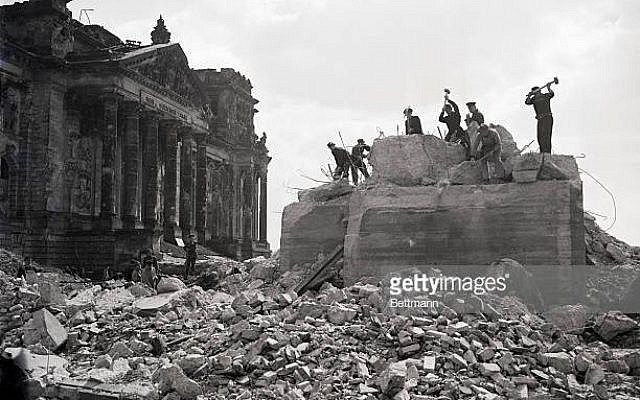 (Original Caption) 7/11/51-Berlin, Germany: The arduous task of removing one of the bunkers in front of the Reichstag. It was used by German troops in their last-ditch battle in Berlin. Acme photo by staff photographer Allyn Z. Baum