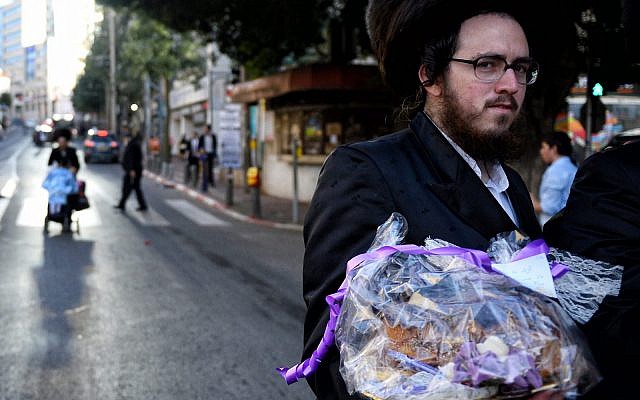 Celebrations of the Jewish holiday of Purim in Bnei Brak, Israel, 2018. (Sergey Orlov\Tass via Getty Images) Celebrations of the Jewish holiday of Purim in Bnei Brak, Israel, 2018. (Sergey Orlov\Tass via Getty Images)