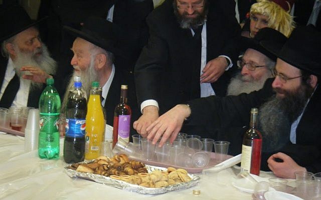 A Purim party in the Mir Yeshiva in Jerusalem (2008). Pictured (from L-R): Rabbi Binyamin Carlebach, Rabbi Refoel Shmuelevitz, Rabbi Dovid Zaretzky (standing), Rabbi Nosson Tzvi Finkel, Rabbi Binyamin Finkel.