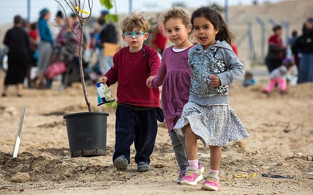 Local children at the first tree planting of the ‘White Hill Farm’, an urban agricultural center for residents of Yerucham and the neighboring Bedouin community of Rachma. February, 2018. (Courtesy of Atid Bamidbar). Local children at the first tree planting of the ‘White Hill Farm’, an urban agricultural center for residents of Yerucham and the neighboring Bedouin community of Rachma. February, 2018. (Courtesy of Atid Bamidbar).