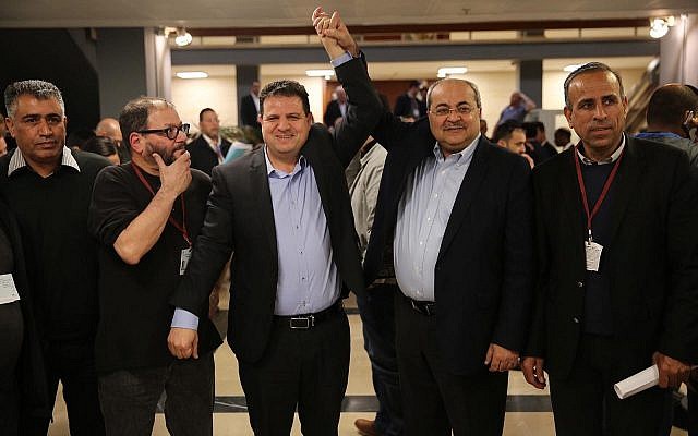 Illustrative. MKs Ayman Odeh and Ahmad Tibi react after submitting a joint list of candidates from their Hadash and Ta'al parties to the Central Elections Committee at the Knesset on February 21, 2019. (Hadash) Illustrative. MKs Ayman Odeh and Ahmad Tibi react after submitting a joint list of candidates from their Hadash and Ta'al parties to the Central Elections Committee at the Knesset on February 21, 2019. (Hadash)