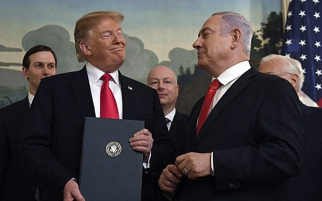 US President Donald Trump and Prime Minister Benjamin Netanyahu after signing a proclamation formally recognizing Israel's sovereignty over the Golan Heights, at the White House in Washington, March 25, 2019 (AP Photo/Susan Walsh)