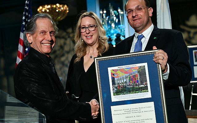 Rachel Heisler Sheinfeld and Dr. Shlomi Codish, right, present award to Edward Oates. Photo by Jared Siskin/Getty Images, courtesy of the American Friends of Soroka Medical Center