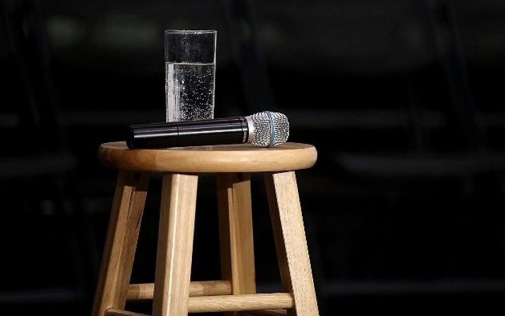 Illustrative: A microphone and a glass of water at an event at the University of Northern Iowa on January 26, 2016. (Justin Sullivan/Getty Images/AFP)