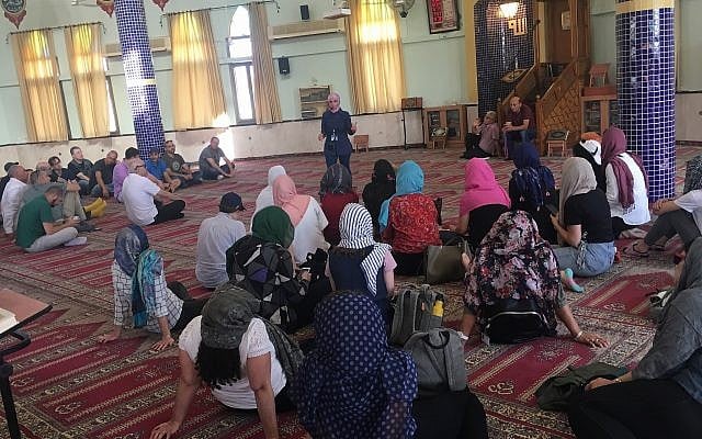 Staff members from Kan (the Israeli Public Broadcasting Corporation) learn about Islam in a Kafr Qara mosque as part of a tour organized by shared society NGO the Abraham Initiatives. Staff members from Kan (the Israeli Public Broadcasting Corporation) learn about Islam in a Kafr Qara mosque as part of a tour organized by shared society NGO the Abraham Initiatives.