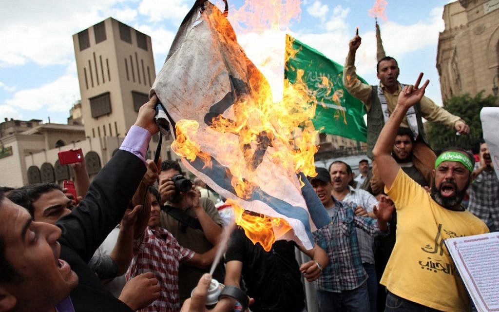 Egyptian men chant anti-Israeli slogans during a Muslim Brotherhood-staged anti-Israel rally in Cairo on May 11, 2013. (Khalil Hamra/AP)