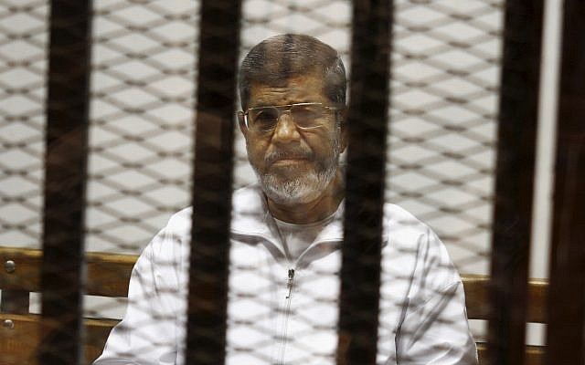Egypt's ousted Islamist president Mohammed Morsi sits in a defendant cage in the Police Academy courthouse in Cairo, Egypt, May 8, 2014. (Tarek el-Gabbas/AP/File)