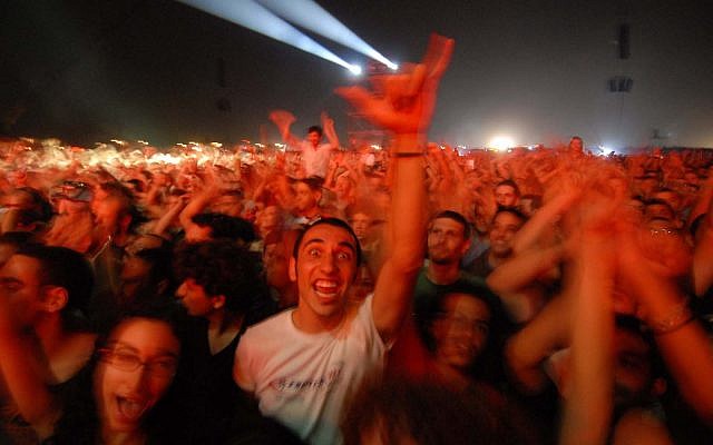 Israeli fans dance during the Roger Waters 'The Wall' concert at Neve Shalom, a mixed Arab-Jewish town. June 22nd 2006 (Guy Assayag /Flash90) Israeli fans dance during the Roger Waters 'The Wall' concert at Neve Shalom, a mixed Arab-Jewish town. June 22nd 2006 (Guy Assayag /Flash90)
