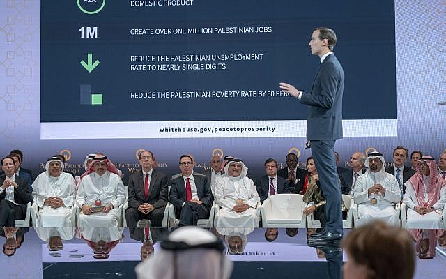 US Treasury Secretary Steven Mnuchin, fifth from left, and Bahrain Crown Prince Salman bin Hamad Al Khalifa, sixth from left, listen to White House senior adviser Jared Kushner, standing, during the opening session of the 'Peace to Prosperity' workshop in Manama, Bahrain on June 25, 2019. (Bahrain News Agency via AP)