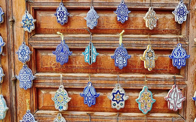 Selection of traditional Moroccan amulets, khamsa, providing defense against the evil eye, on a market in Fes (Selection of traditional Moroccan amulets, khamsa, providing defense against the evil eye, on a market in Fes, ASCII, 109 components, 109 by