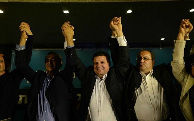 Illustrative. Arab Joint List head Ayman Odeh (center) reacts with other party members at the party headquarters in Nazareth as election exit polls are announced, March 17, 2015. (Basel Awidat/Flash90/File)