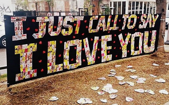 On Valentine's day, 2017, two local artists, Alex Kurbatov and Avane Borian, pay tribute to the daily suffering of women in the sex trade, and send a reminder of love to those women. The art is constructed from the business cards of prostitutes in Tel Aviv. (Courtesy of Her Academy) On Valentine's day, 2017, two local artists, Alex Kurbatov and Avane Borian, pay tribute to the daily suffering of women in the sex trade, and send a reminder of love to those women. The art is constructed from the business cards of prostitutes in Tel Aviv. (Courtesy of Her Academy)