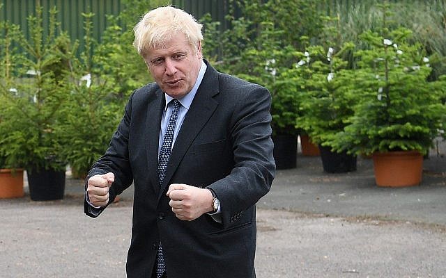Conservative MP and leadership contender Boris Johnson gestures during a leadership campaign visit to a nursery in Braintree, southeast England, on July 13, 2019. (Neil Hall/Pool/AFP) Conservative MP and leadership contender Boris Johnson gestures during a leadership campaign visit to a nursery in Braintree, southeast England, on July 13, 2019. (Neil Hall/Pool/AFP)