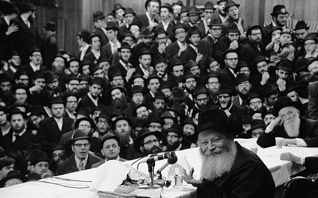 Rabbi Menachem Mendel Schneerson, at the microphone, shown in New York circa 1975. (Tim Boxer/Getty Images) Rabbi Menachem Mendel Schneerson, at the microphone, shown in New York circa 1975. (Tim Boxer/Getty Images)