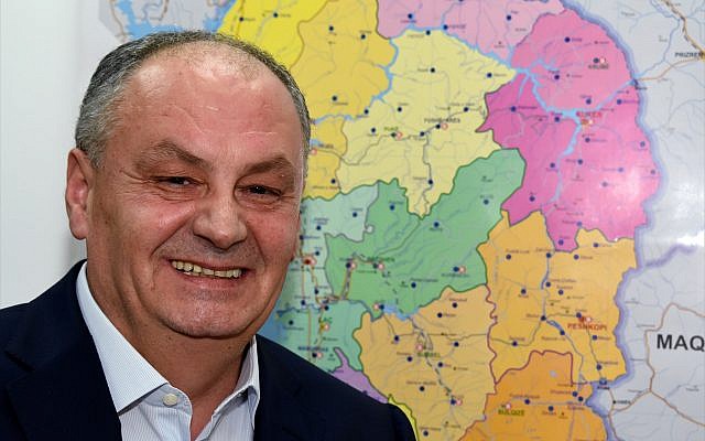 Bardhyl Canaj, Albania's ambassador to Israel, in front of a map of his Balkan country. (Larry Luxner)
