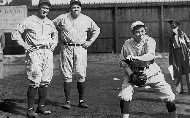 Yankee teammates Lou Gehrig, left, and Babe Ruth study the form of 17-year old Chattanooga Lookouts minor league pitcher Jackie Mitchell, one of the first women to play professional baseball, at an exhibition game on  April 2, 1931, in Chattanooga. With a sharp breaking ball, Mitchell thrilled the local fans by striking out both Ruth and Gehrig, back-to-back, in the first inning. Judge Kenesaw Mountain Landis, the baseball commissioner, voided Mitchell's contract shortly after the exhibition, saying baseball was 'too strenuous' for women. (AP Photo/File)