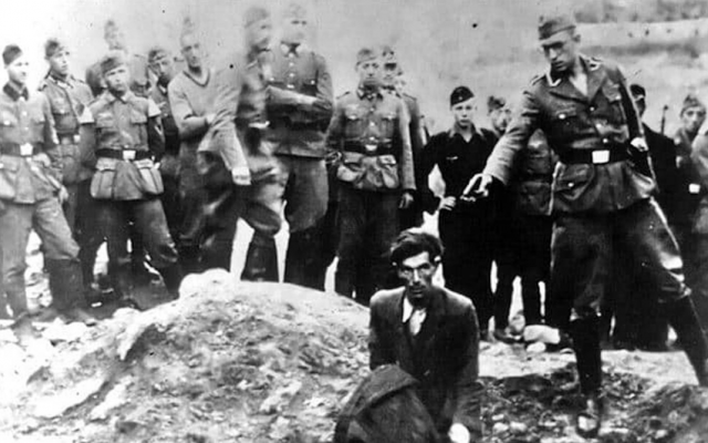 A photograph known as "The Last Jew in Vinnitsa" taken during the Holocaust in Ukraine showing a Jewish man near the town of Vinnitsa about to be shot dead by a member of the Nazis' Einsatzgruppe. (Public Domain)