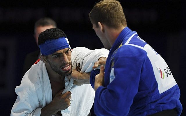 In this picture taken on August 28, 2019, Iran's Saeid Mollaei (in white) fights against Belgium's Matthias Casse during the semifinal of the men's under-81kg category during the 2019 Judo World Championships, in Tokyo, Japan. (Charly TRIBALLEAU / AFP)