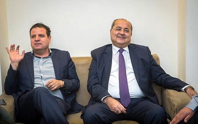 Leader of the Joint list Ayman Odeh (L) and party member Ahmad Tibi meet at the Knesset on September 22, 2019, ahead of their meeting with the President where they will give their recommendation for who will be given the mandate to build the next coalition following the elections. (Yonatan Sindel/Flash90)