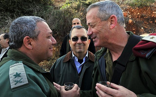 Then-defense minister Ehud Barak (center), then-IDF chief of staff Benny Gantz (right), and Gantz's successor in the role Gadi Eisenkot, pictured near the northern border on February 15, 2011. (Defense Ministry/ Flash90/ File) Then-defense minister Ehud Barak (center), then-IDF chief of staff Benny Gantz (right), and Gantz's successor in the role Gadi Eisenkot, pictured near the northern border on February 15, 2011. (Defense Ministry/ Flash90/ File)