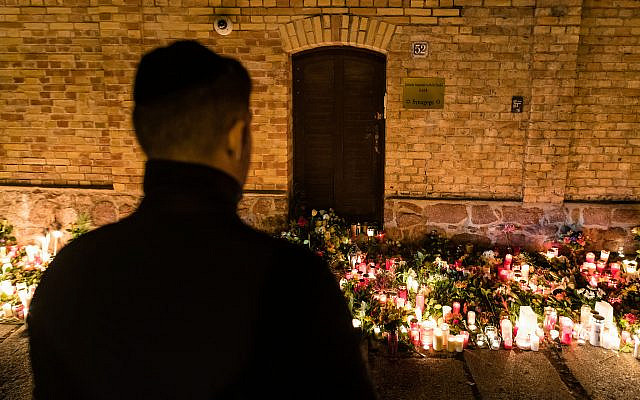 A man views a makeshift memorial at the entrance to the synagogue in Halle, Germany, October 10, 2019. (Jens Schlueter/Getty Images) A man views a makeshift memorial at the entrance to the synagogue in Halle, Germany, October 10, 2019. (Jens Schlueter/Getty Images)