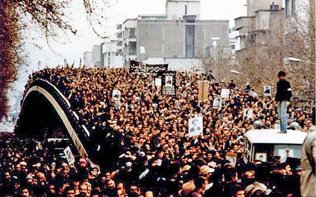 Demonstration in Iran during the revolution, with protesters holding up placards featuring the Ayatollah (Wikipedia/ GNU Free Documentation License/Author: Unknown via Jewish News) Demonstration in Iran during the revolution, with protesters holding up placards featuring the Ayatollah (Wikipedia/ GNU Free Documentation License/Author: Unknown via Jewish News)