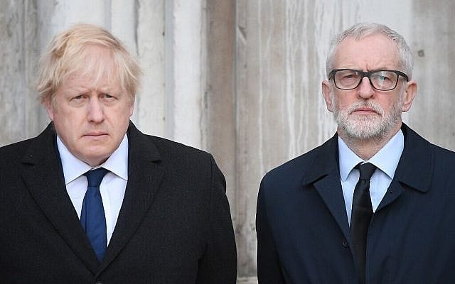 Britain's Prime Minister Boris Johnson (L) and opposition Labour party leader Jeremy Corbyn take part in a vigil at the Guildhall in central London to pay tribute to the victims of the London Bridge terror attack on December 2, 2019. (Photo by DANIEL LEAL-OLIVAS / AFP)