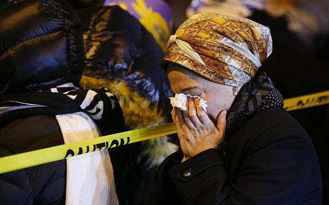 Women mourn during the funeral service of Mindel Ferencz, who was killed in a shooting at a kosher market in Jersey City, New Jersey, December 11, 2019. (AP Photo/Eduardo Munoz Alvarez) Women mourn during the funeral service of Mindel Ferencz, who was killed in a shooting at a kosher market in Jersey City, New Jersey, December 11, 2019. (AP Photo/Eduardo Munoz Alvarez)