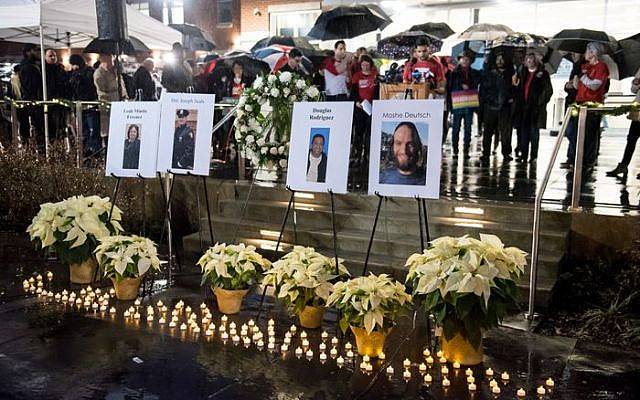 Students Demand Action, Moms Demand Action, Hudson Partnership CMO, and Jersey City Anti-Violence Coalition host a candlelight vigil outside the Jersey City City Hall annex to honor and remember the victims of the recent mass shooting, Friday, Dec. 13, 2019. (Reena Rose Sibayan | The Jersey Journal)