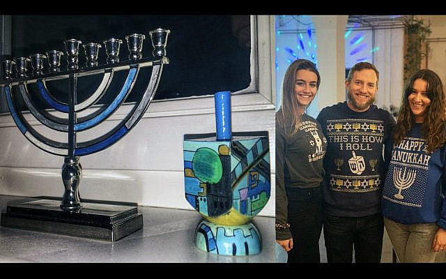 The author's hanukkiyah, dreidel and two co-workers wearing Hanukkah sweaters. (Joe Baur)