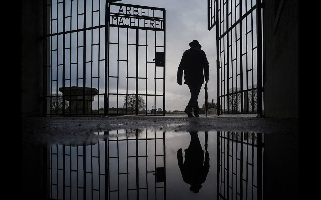 A man walks through the gate of the Sachsenhausen Nazi death camp below the phrase 'Arbeit macht frei' (work sets you free) at the International Holocaust Remembrance Day, in Oranienburg, north of Berlin, Jan. 27, 2019. (AP Photo/Markus Schreiber) A man walks through the gate of the Sachsenhausen Nazi death camp below the phrase 'Arbeit macht frei' (work sets you free) at the International Holocaust Remembrance Day, in Oranienburg, north of Berlin, Jan. 27, 2019. (AP Photo/Markus Schreiber)