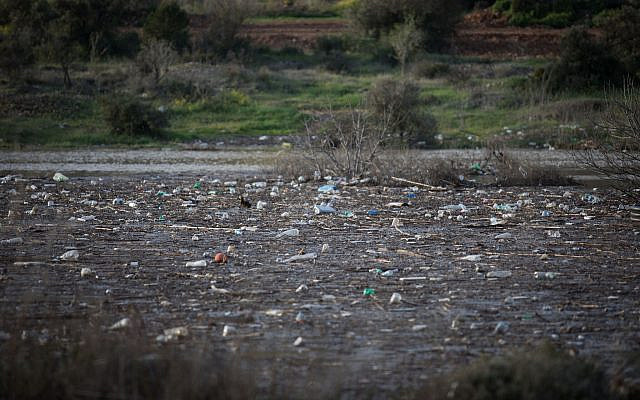 Illustrative. Plastic bottles and other trash in the Beit Zait water reservoir near Jerusalem, on March 1, 2019. (Hadas Parush/Flash90) Illustrative. Plastic bottles and other trash in the Beit Zait water reservoir near Jerusalem, on March 1, 2019. (Hadas Parush/Flash90)