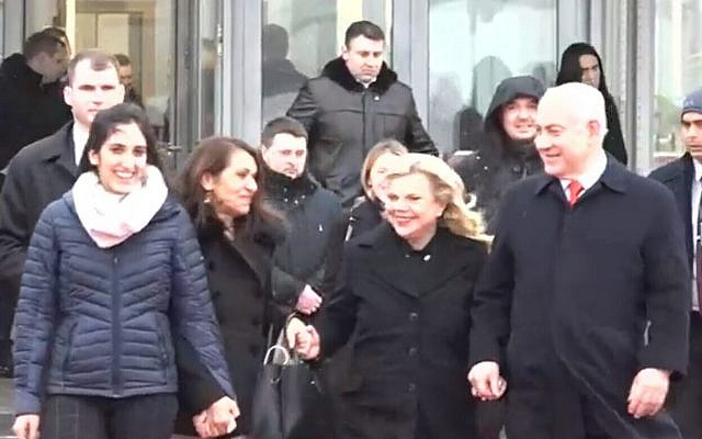 Naama (R) and Yaffa Issachar (2nd R), along with Prime Minister Benjamin Netanyahu (L) and his wife Sara (2nd L) at Moscow Airport, January 30, 2020. (Screen grab/Channel 12 News)