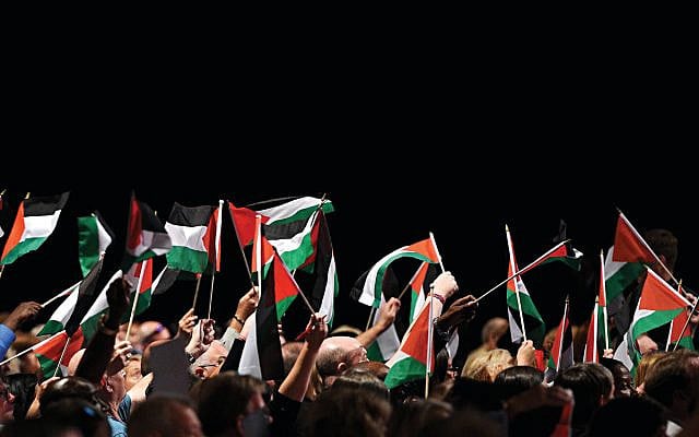 Delegates hold up Palestinian flags during a debate at Labour party conference, 2018. (Photo by Oli SCARFF / AFP) (Photo credit should read OLI SCARFF/AFP/Getty Images via Jewish News) Delegates hold up Palestinian flags during a debate at Labour party conference, 2018. (Photo by Oli SCARFF / AFP) (Photo credit should read OLI SCARFF/AFP/Getty Images via Jewish News)