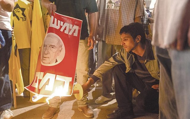 Dramatization from Incitement - Amir torches anti-Rabin Poster at 1995 Protest Rally