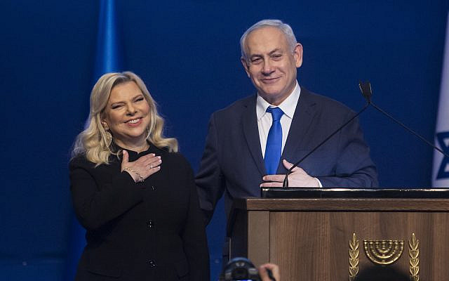 Israeli Prime Minister Benjamin Netanyahu and wife Sara thank Likud supporters at a Tel Aviv celebration of the party's election victory, March 3, 2020. (Amir Levy/Getty Images) Israeli Prime Minister Benjamin Netanyahu and wife Sara thank Likud supporters at a Tel Aviv celebration of the party's election victory, March 3, 2020. (Amir Levy/Getty Images)