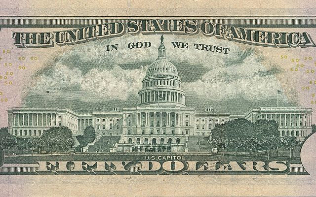 The US $50 Bill with "In God We Trust" Proudly Displayed Above A Full Picture Of The US Capitol Building located in Washington D.C. It is a reasonable assumption that the US Capitol was the primary target of Flight 93 which failed to reach its target during 9/11 due to the brave heroes that fought the terrorists which resulted in saving a countless number of  lives.