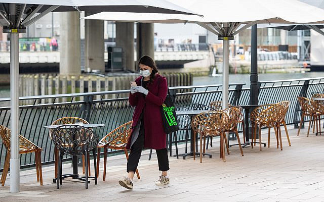 A woman wearing a protective face mask and gloves (Photo credit: Dominic Lipinski/PA Wire via Jewish News) A woman wearing a protective face mask and gloves (Photo credit: Dominic Lipinski/PA Wire via Jewish News)