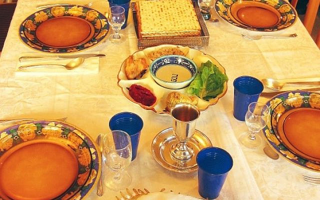 Illustrative. A seder table, including a fifth wine glass, traditionally for Elijah. (iStock)