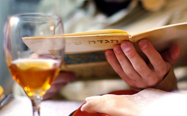 Illustrative. Reading the Haggadah during a solo Passover seder. (iStock) Illustrative. Reading the Haggadah during a solo Passover seder. (iStock)